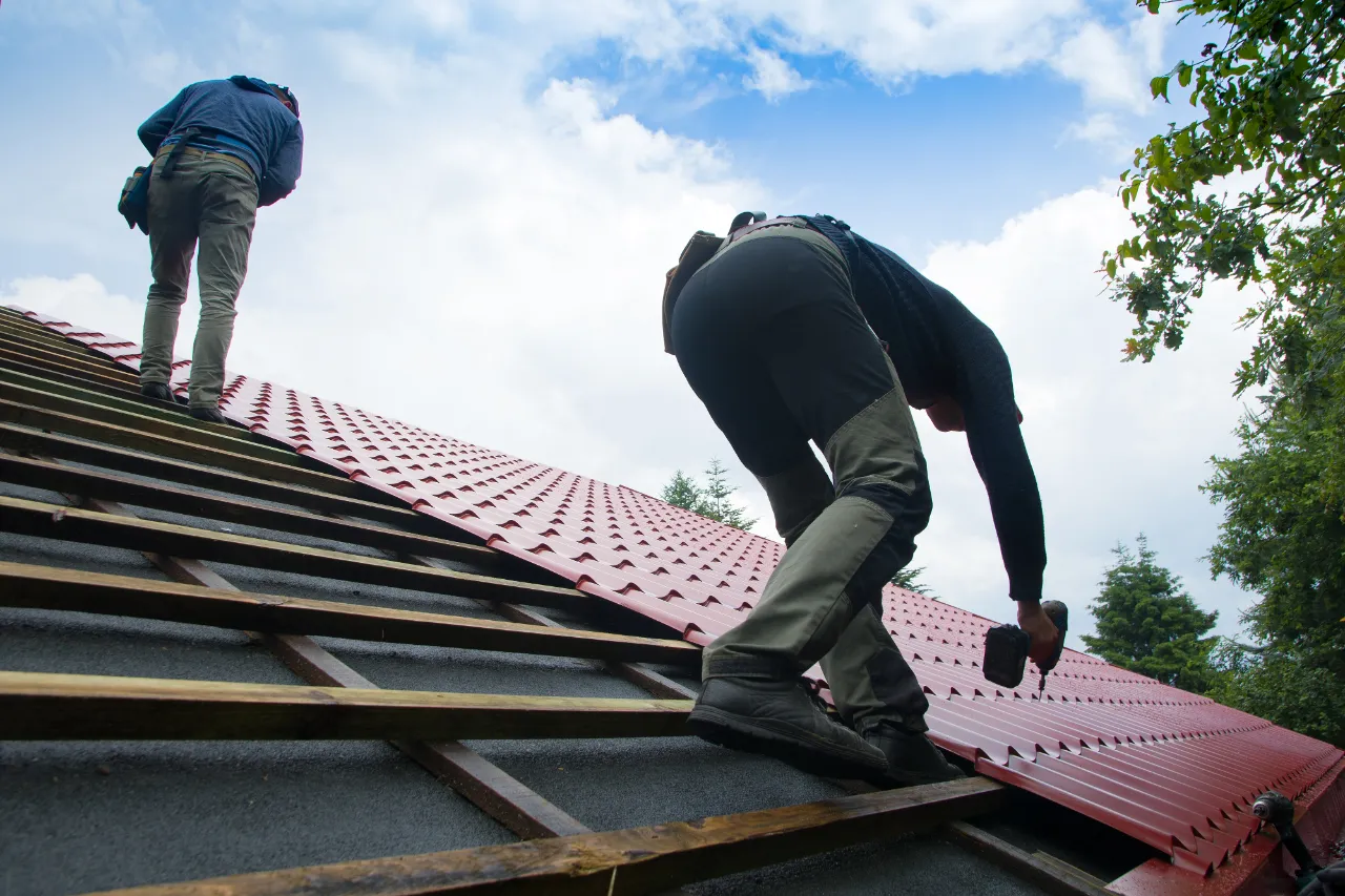 Professional PCA Construction roofer wearing safety helmet on a residential job in Connecticut